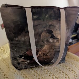 Large Tote Bag with a Cotton Duck panel and Herringbone fabric on the back with shoulder straps and zip for closure.